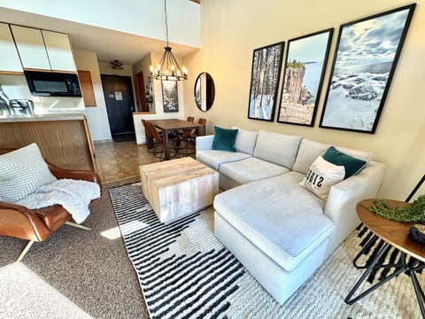 Living Room: Sun-soaked space with artful decor, perfect for relaxation and gathering!