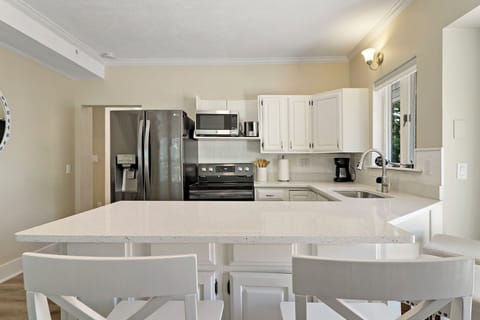 Kitchen and seating for dining.