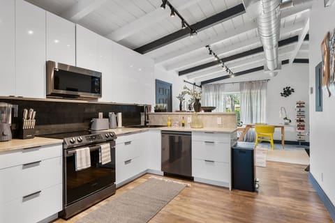 kitchen equipped with all European Alessi appliances- toaster, kettle, blender