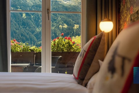 Hypo-allergenic bedding, down comforters, minibar, in-room safe