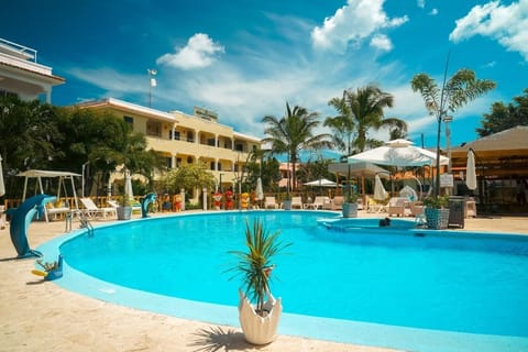 Outdoor pool, open 7:30 AM to 6:00 PM, pool umbrellas