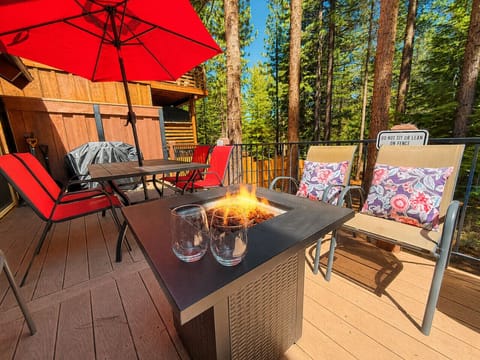 Back deck with gas fire pit, table & string lights