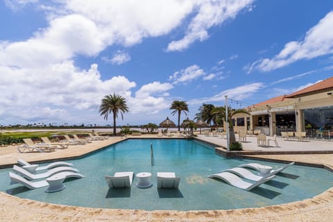 - Enjoy a dip in our resort's shared pool area in Noord, Aruba - A perfect spot for cooling off and unwinding - Lounge by the poolside and soak up the sun with the convenience of cozy beach chairs - Our resort's pool is designed for ultimate leisure