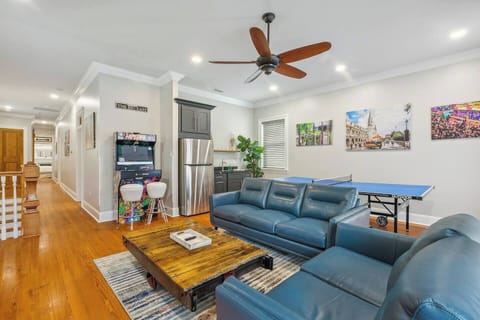 Upstairs game room includes refrigerator with ice maker, 65" smart tv, ping pong table, video arcade machine and a Nostalgic Jukebox set up with "Bluetooth" to play your personal tunes.