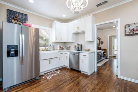 Beautiful hardwood floors and gold accents throughout!