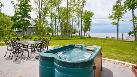Relax and unwind in your backyard oasis! Enjoy the hot tub with stunning lake views!