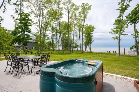 Relax and unwind in your backyard oasis! Enjoy the hot tub with stunning lake views!