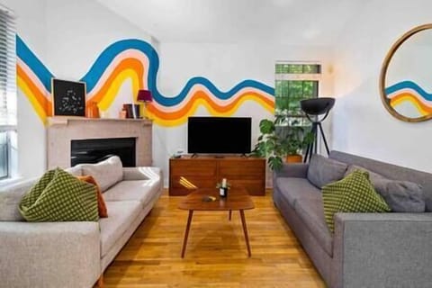 The dark gray couch pulls out into a queen bed and can sleep 2 people (1)