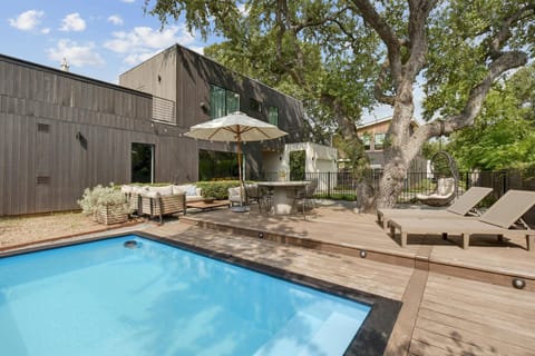 Pool are with outdoor seating for a fun pool day