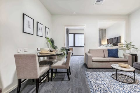 Living and Dining at Lagoon: Open-plan living and dining area with modern furnishings, perfect for relaxing or enjoying meals together