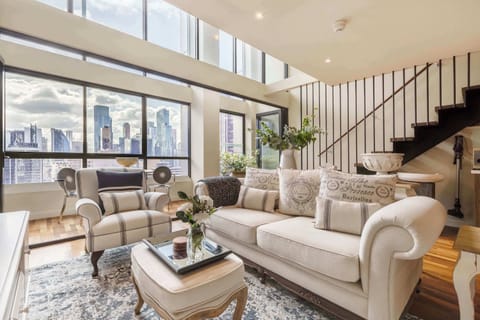 Sophisticated lounge with classic décor and panoramic city outlook