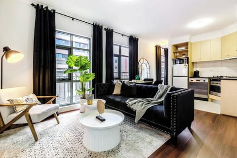 Living Room and Kitchenette at Monet: Stylish and cozy apartment with modern décor, a spacious living area, and a fully equipped kitchen, perfect for relaxing or entertaining during your stay