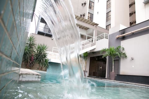 Outdoor pool, open 6:00 AM to 10:00 PM, sun loungers