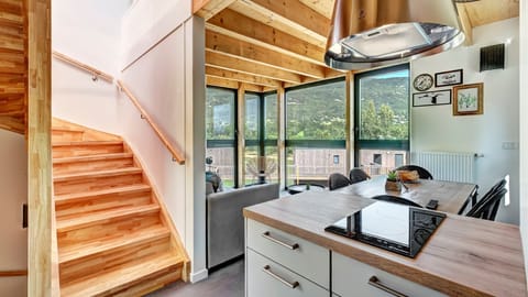 Prepare meals in the kitchen and enjoy them at the dining table.