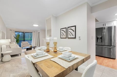 a haven for communal gatherings with its ample seating for four, set against the backdrop of culinary delights emanating from the fully equipped kitchen