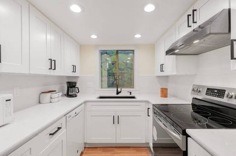 Within this culinary haven, modern appliances stand ready to assist in culinary endeavors, while generous counter space beckons creativity and convenience alike.