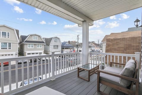 Relax and soak up the local atmosphere from your private covered balcony, featuring comfortable outdoor seating and a coffee table. Sip your morning coffee or evening drink while enjoying the lively street scene and characteristic neighborhood.