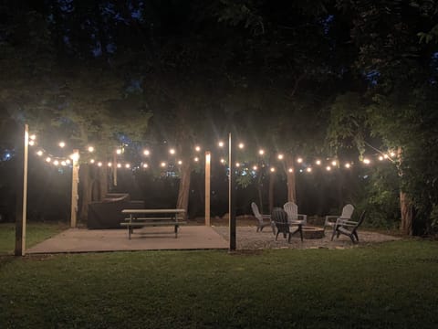 Cabin in Downtown Pigeon Forge "River Cottage" - Outdoor patio area at night