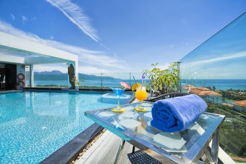Outdoor pool, open 6:00 AM to 10:00 PM, pool umbrellas, sun loungers