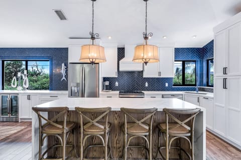 Guests Can Enjoy Informal Meals and Conversations at the Kitchen Counter