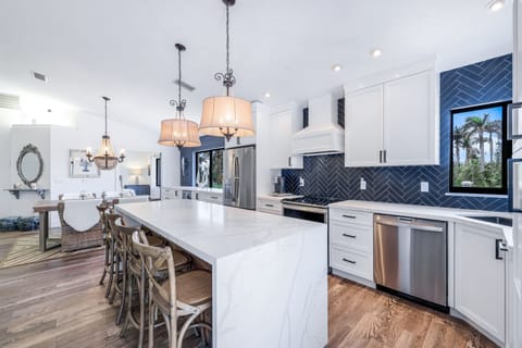 The Large Waterfall Edge Kitchen Island Is Spacious