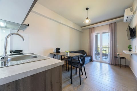 Family Apartment, Garden View | Private kitchen | Fridge, stovetop, espresso maker, coffee/tea maker