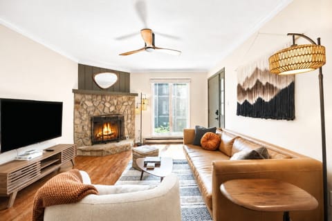 Unwind in the comfy living space with cozy seating and gas log fireplace