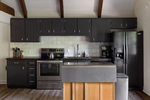 Recently refreshed kitchen features butcher’s block countertops.  The kitchen is open to both the living room and the dining room which creates a great hangout area for larger groups.