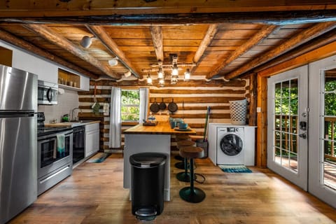The kitchen space is a perfect setup for your group. Bar stools are also provided for additional seating.