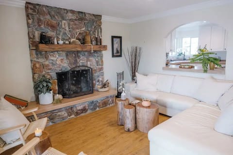 Cozy up on the Italian leather sofa next to the masonry wood burning fireplace