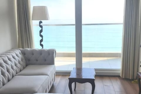 Family Apartment, Balcony, Partial Sea View | Living area | Flat-screen TV