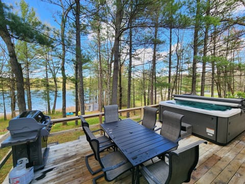 Deck with grill, dining area & hot tub