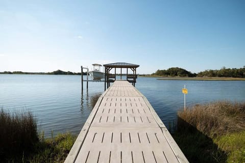 Expansive 70-foot private pier extends into the Intracoastal Waterway, offering incredible opportunities for fishing, boating, and sightseeing.