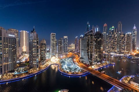 Cityscape View: Experience dazzling skyline vistas from your luxury balcony at night!