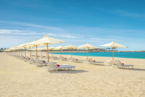 Private beach, white sand, sun loungers, beach umbrellas