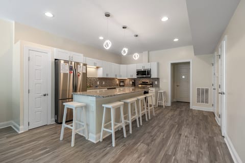 The kitchen island provides additional counter space for serving snacks & meals.