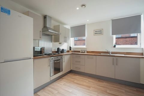 Fully equipped kitchen with modern appliances.