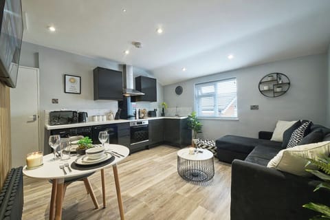 The apartment includes a modern kitchen/dining area, which is open plan and fully equipped with all of the utensils & crockery you need to cook during your stay.