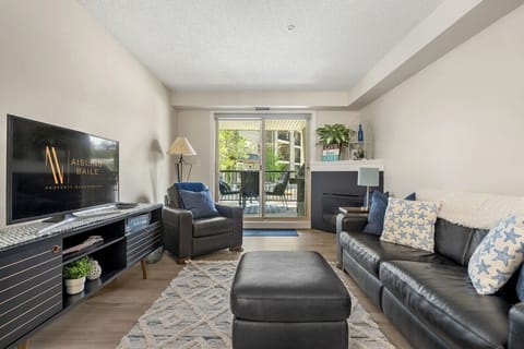 Living room with fireplace, Smart TV with cable, board games & access to the private ground-floor patio.