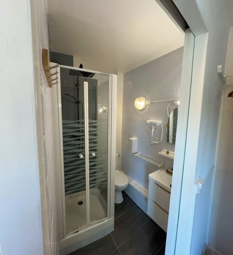 Basic Double Room, Courtyard View | Bathroom | Shower, hair dryer, towels, soap