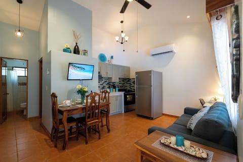 Comfortable open living space with a dedicated workspace and pullout sofa