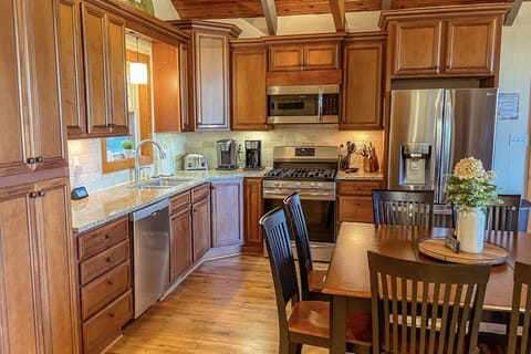 Everything you need, right where you need it—to include cabinet space to store groceries and supplies- cook, snack, or gather in this fully-stocked kitchen.