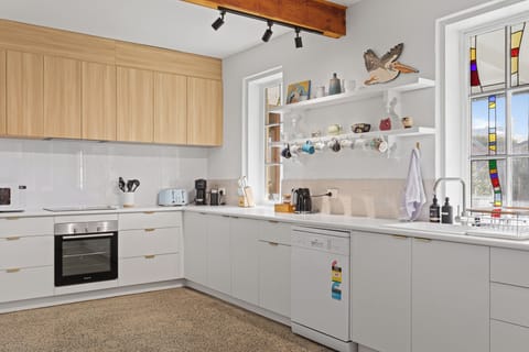 Cook with ease with a stove/oven, microwave, fridge/freezer, and the grocer just steps away