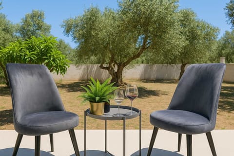 Outdoor Seating Area with Chairs and Table – A peaceful spot to enjoy morning coffee or evening drinks while surrounded by nature.