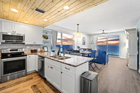 Spacious luxury awaits in this corner unit with wide beach and ocean views
