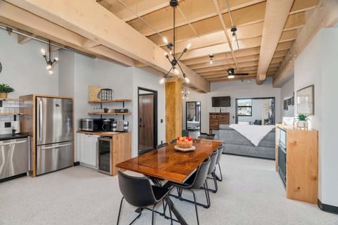 Step into your bright, airy living area, illuminated by a skylight. A spacious table for eight stands ready for delightful dinners and cheerful gatherings. It’s a perfect blend of light and warmth!  A skylight lets in natural light during the day.