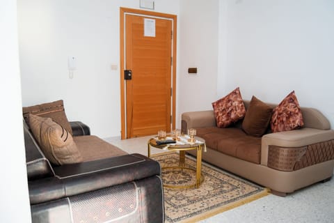 Basic Apartment, Balcony | Living area | Flat-screen TV