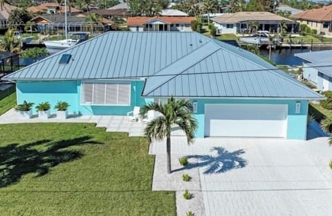 PARADISE FOUND IN IMMACULATE DESIGNER WATERFRONT HOME