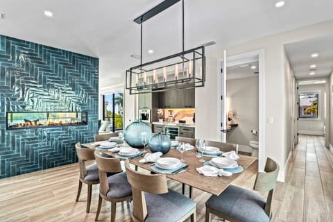 Gather around the dining table warmed by the glow of the fireplace, perfect for intimate meals and heartfelt conversations.