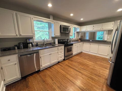 The kitchen is fully stocked! Pots, pans, dishes, coffee maker, kettle, blender, toaster, wine glasses, and more. Make sure you check the pantry for outside plates, cups, and wine glasses.